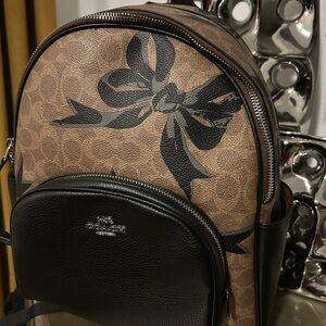CoachTan Brown and Black Bow Signature Canvas and Leather Backpack Purse EUC